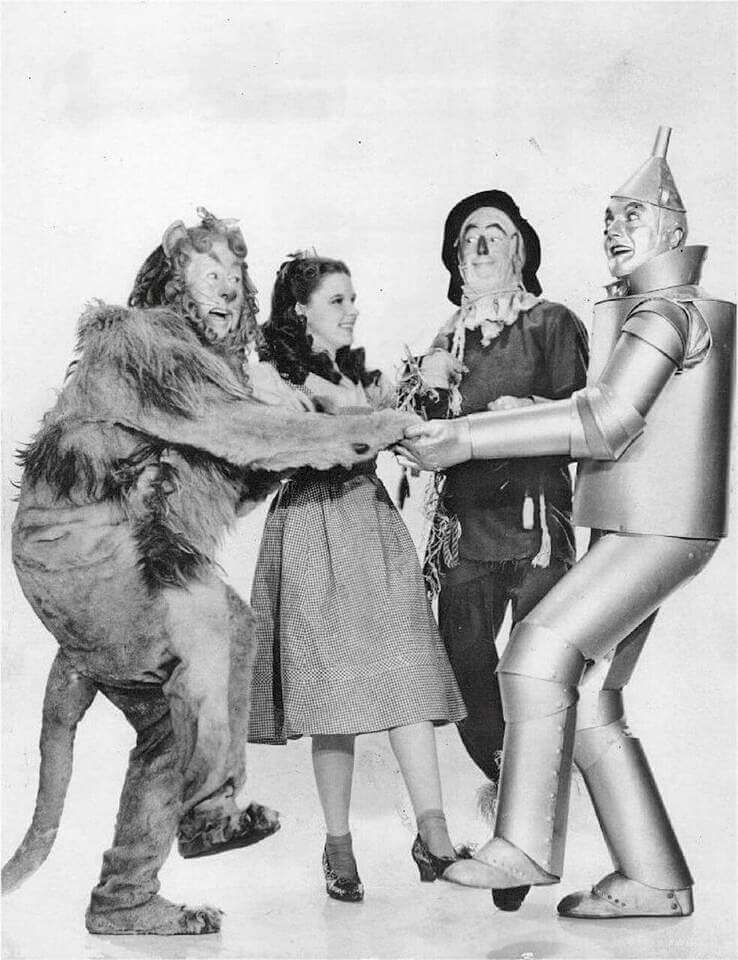 A black-and-white photo of the four main characters from The Wizard of Oz.