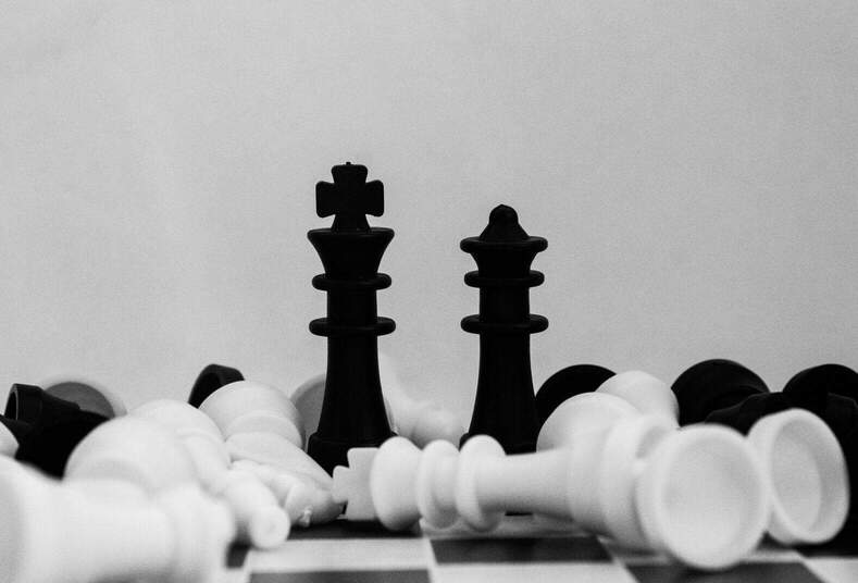 A black-and-white photo of part of a chess set.
