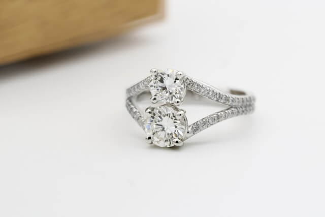 Multiple gemstone engagement ring on white background