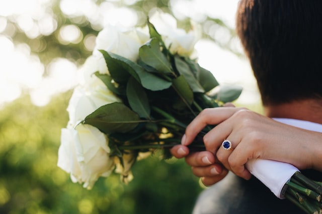 wedding photo showcasing sapphire engagement ring